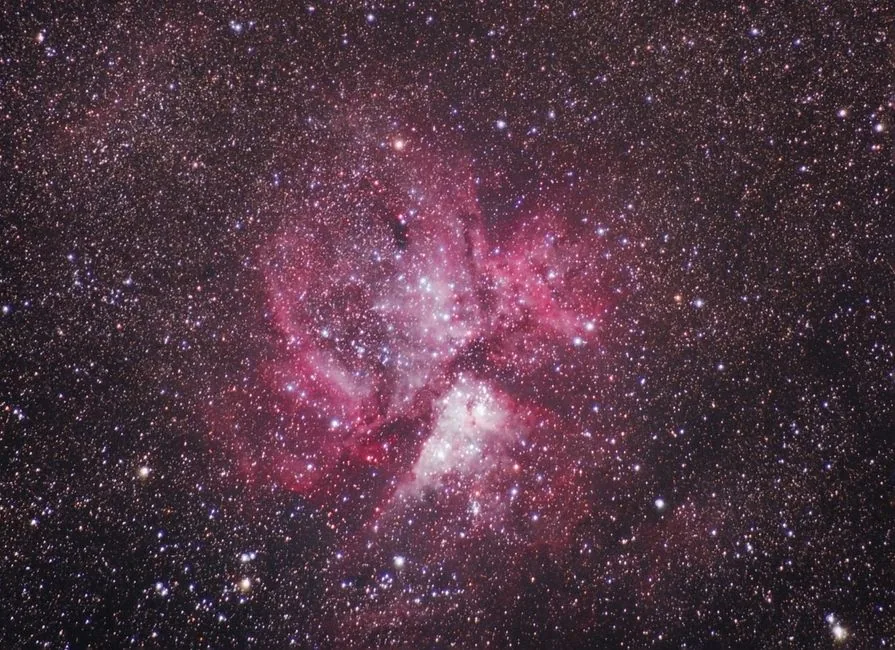 Captured image of a vibrant nebula surrounded by countless stars in the universe.