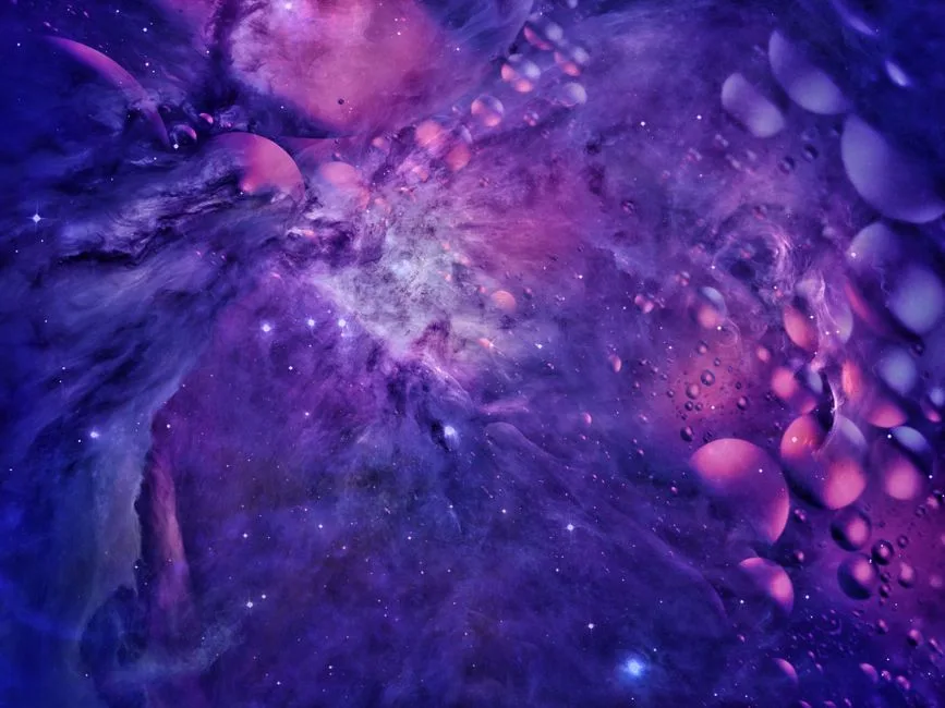 Explore a purple-hued abstract cosmic scene with floating shapes and bubbles.